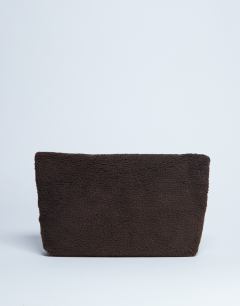 Model wearing Georgia folded borg clutch grab bag in chocolate