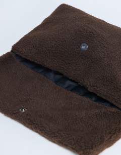 Model wearing Georgia folded borg clutch grab bag in chocolate