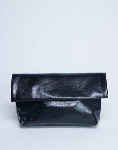 Model wearing Georgia folded clutch grab bag in black