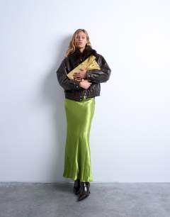 Model wearing Georgia folded clutch grab bag in gold