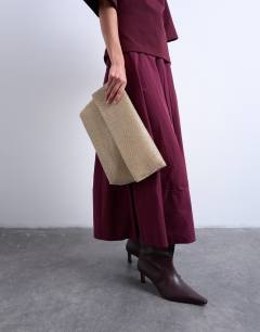 Model wearing Georgia folded clutch grab diamante bag in gold