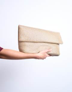 Model wearing Georgia folded clutch grab diamante bag in gold