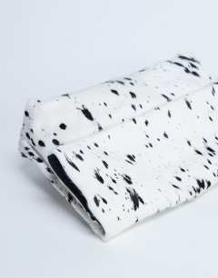 Model wearing Georgia hair on leather folded clutch grab bag in dalmatian