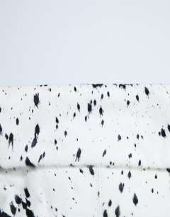 Model wearing Georgia hair on leather folded clutch grab bag in dalmatian