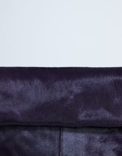 Model wearing Georgia hair on leather folded clutch grab bag in purple