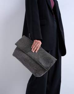 Model wearing Georgia large folded clutch grab diamante bag in black
