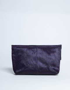Model wearing Georgia leather folded clutch grab bag in purple pony