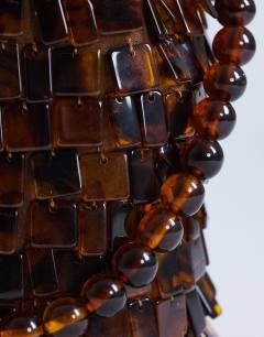 Model wearing Georgie embellished grab bucket bag in brown tort