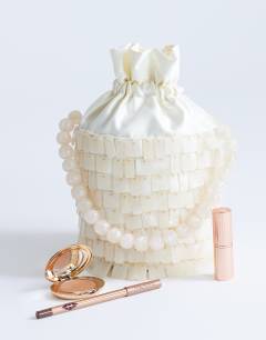 Model wearing Georgie embellished grab bucket bag in ivory