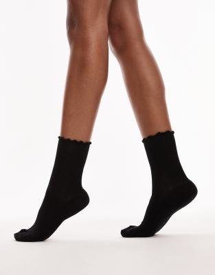 Topshop - Gerippte Socken in Schwarz mit Rüschen