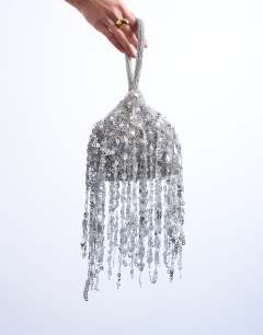 Model wearing Giana sequin tassel grab bag in silver