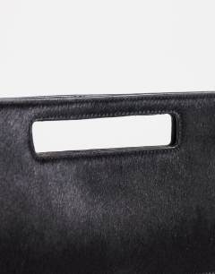 Model wearing Giavanna hair on real leather medium rectangle grab bag in black
