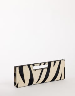 Model wearing Giavanna hair on real leather medium rectangle grab bag in zebra