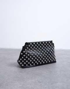 Model wearing Gideon studded clutch bag in black