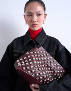 Gideon studded clutch bag in burgundy