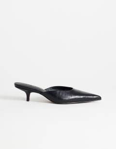 Model wearing Gigi kitten heel court shoe in black