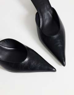 Model wearing Gigi kitten heel court shoe in black