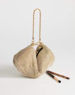 Model wearing Ginny diamante grab bag in gold