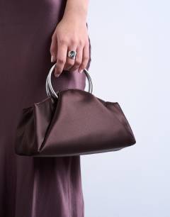 Model wearing Ginny metal handle grab bag in chocolate