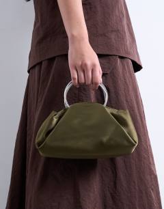 Model wearing Ginny metal handle grab bag in khaki