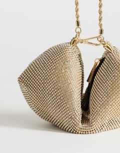Model wearing Ginny small diamante grab bag in gold