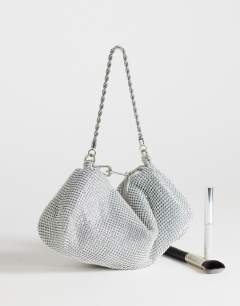 Model wearing Ginny small diamante grab bag in silver