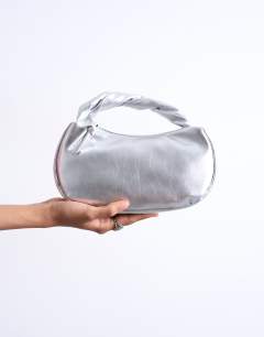 Model wearing Gladys grab bag in silver