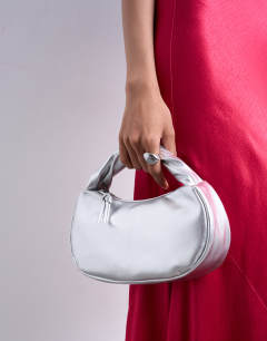 Model wearing Gladys grab bag in silver