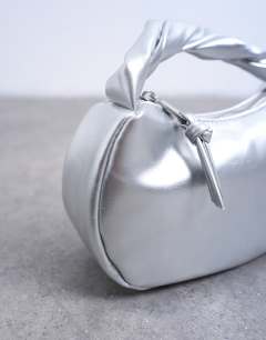 Model wearing Gladys grab bag in silver