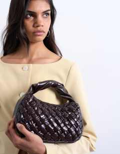 Model wearing Gladys woven grab bag in chocolate