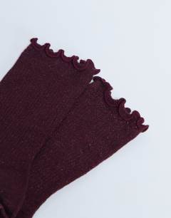 Model wearing Glitter socks in burgundy