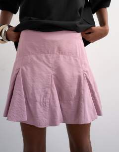Model wearing Godet hem mini skirt in lilac