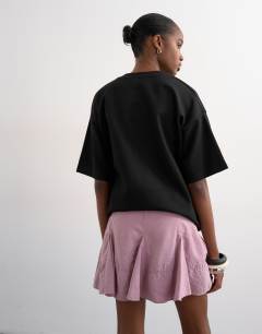 Model wearing Godet hem mini skirt in lilac