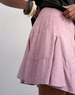 Model wearing Godet hem mini skirt in lilac