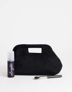 Model wearing Gordan medium suedette clutch with handle in black