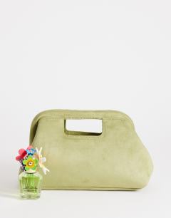 Model wearing Gordan medium suedette clutch with handle in olive