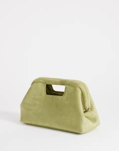 Model wearing Gordan medium suedette clutch with handle in olive