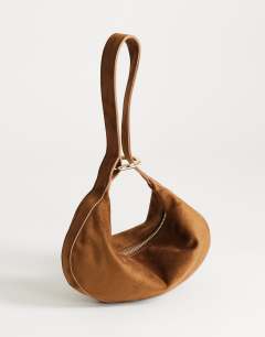 Model wearing Grace small faux suede scoop grab bag in tan