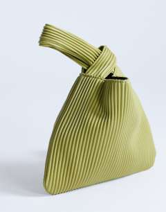 Model wearing Gracie grab bag in chartreuse