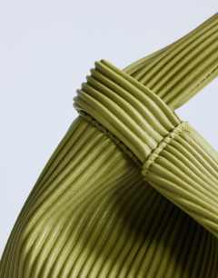 Model wearing Gracie grab bag in chartreuse