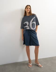 Model wearing Graphic '74' washed t-shirt in charcoal