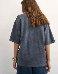 Model wearing Graphic '74' washed t-shirt in charcoal