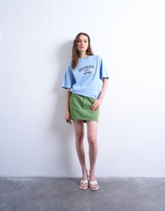 Model wearing Graphic Barcelona oversized tee in blue