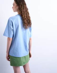 Model wearing Graphic Barcelona oversized tee in blue