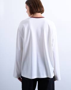 Model wearing Graphic Brasilia contrast ringer skater tee in white