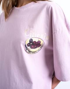 Model wearing Graphic ciliegia back print oversized tee in pink