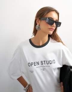 Model wearing Graphic cinched waist piping detail in ecru