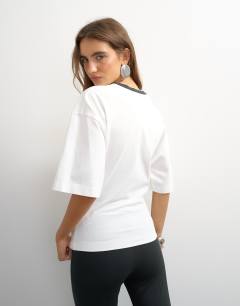 Model wearing Graphic cinched waist piping detail in ecru