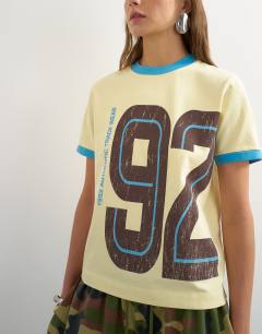 Model wearing Graphic colour block cuff tee in yellow