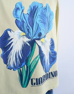 Model wearing Graphic Giardino Iris skater tee in green